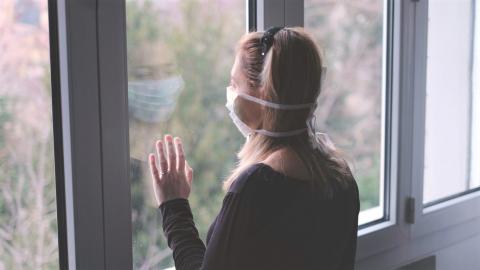 Horizontal background woman in isolation at home for virus outbreak Credit: Luca Lorenzelli